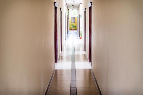 an empty hallway with a long corridor at Hotel Palmar del Río Premium in Archidona