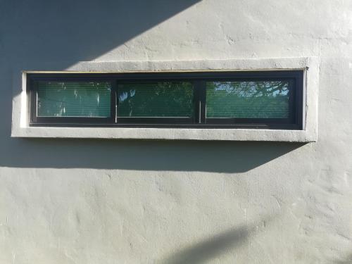 a window on the side of a building at Cashew Nut Bungalow, Ko Mook in Koh Mook