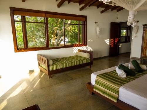 Una cama o camas en una habitación de Little Tamarind