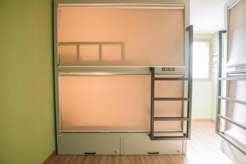 an empty closet with a ladder in a room at Daegu Midtown Hostel in Daegu