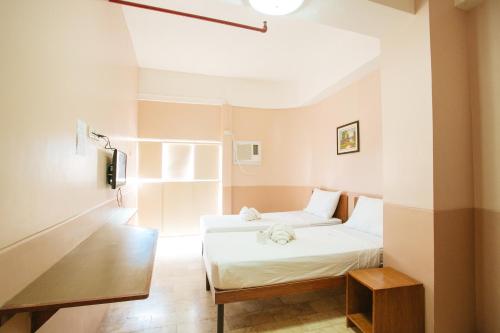 Giường trong phòng chung tại GV Hotel - Tagbilaran City
