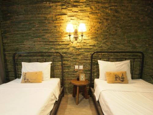 Postel nebo postele na pokoji v ubytování Niras Bankoc Hostel