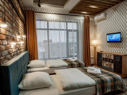 Кровать или кровати в номере Отель SandS of Time