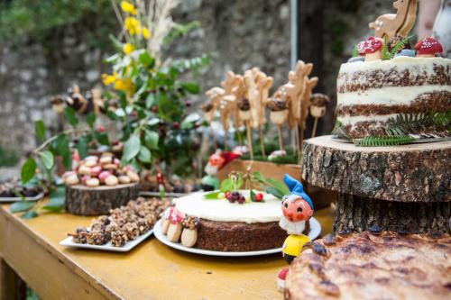 a table with a cake and other desserts on it at Hotel Archontiko Anyfanti in Zátouna