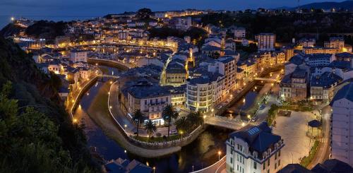 an aerial view of a city at night at Casa Del Beso in Luarca