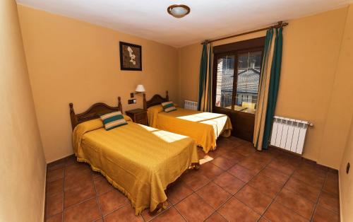 Postel nebo postele na pokoji v ubytování Apartamentos Raisa