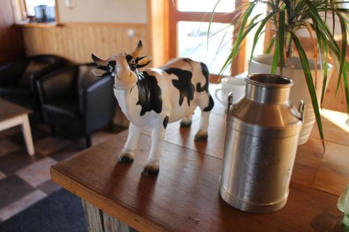 a figurine of a cow on top of a table at Hótel Á in Reykholt