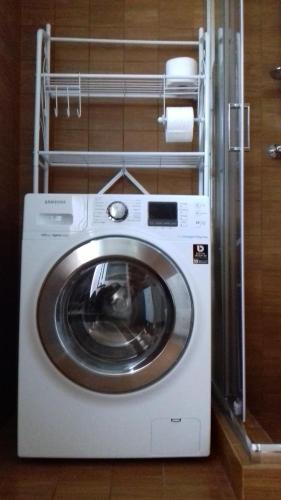 a washer and dryer in a room at Miklù Luxury Suite in Lecce