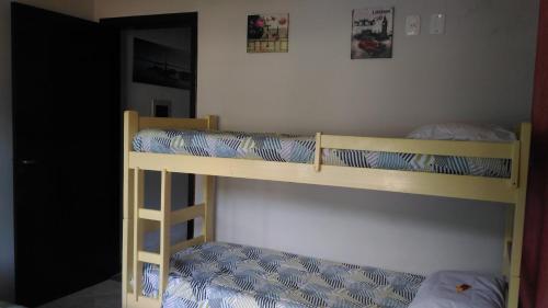 En eller flere senge i et værelse på Apartamento Bay Conceicao