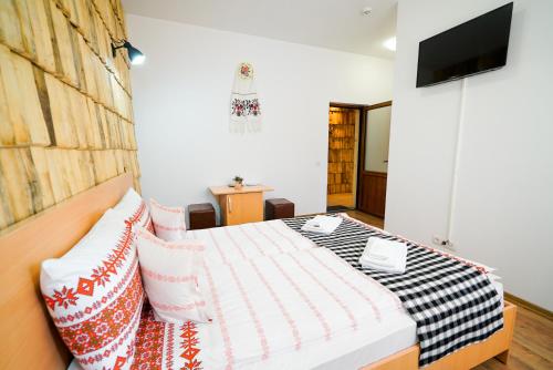 Postel nebo postele na pokoji v ubytování Casa Ralucăi
