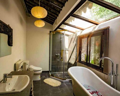 Ett badrum på Pure-Land Villa