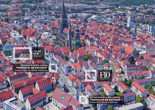 an aerial view of a city with a tall tower at F10 APARTMENTS Ulm in Ulm