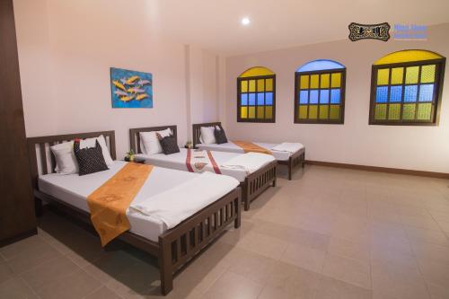 Postel nebo postele na pokoji v ubytování Ming Shou Boutique House