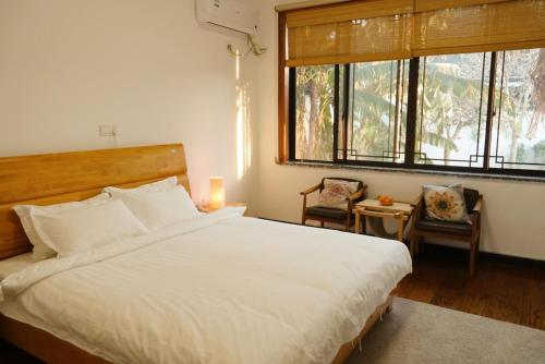 מיטה או מיטות בחדר ב-Pure-Land Villa