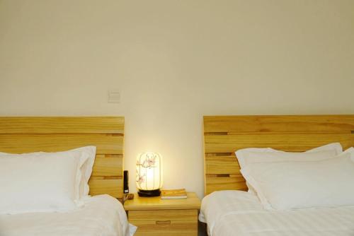 Postel nebo postele na pokoji v ubytování Pure-Land Villa