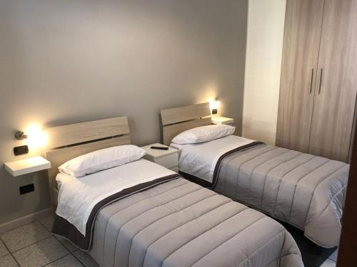 Postel nebo postele na pokoji v ubytování Al cortile