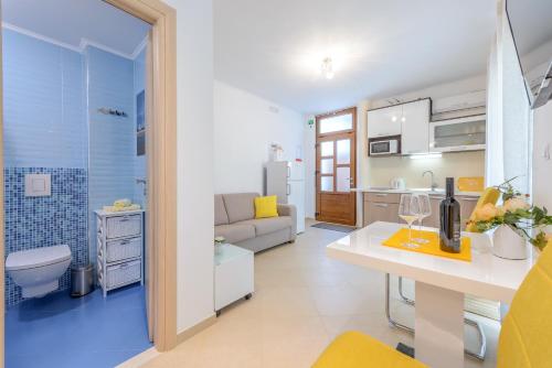 a room with a kitchen and a living room at Villa Ive in Mlini