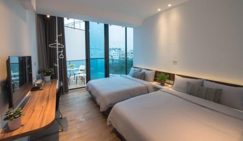 Postel nebo postele na pokoji v ubytování Galilee B&B 加利利海民宿