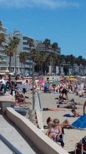 a group of people laying on the beach at Villa Bruyere in Antibes