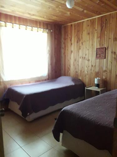 Een bed of bedden in een kamer bij Cabañas del Español
