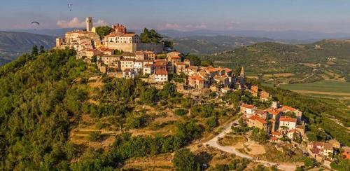 a village on top of a hill with houses at Soba Gracijela in Motovun