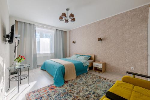 מיטה או מיטות בחדר ב-Apartments at Yaroslavskiy prospekt