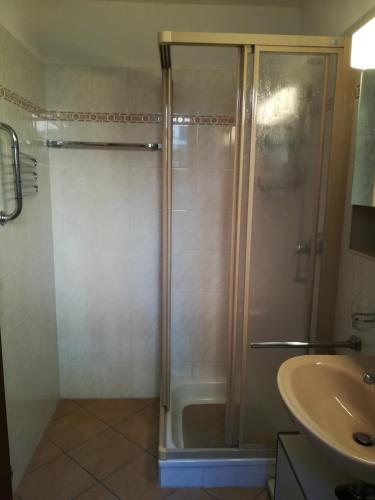 a bathroom with a shower and a sink at Casa Olivo in Montagnola