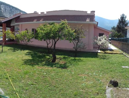 a house with a garden in front of it at Circeo Home La Mola in San Felice Circeo