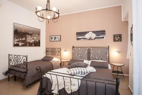 Postel nebo postele na pokoji v ubytování B&B Trio D'Archi - La Pilozza Infiorata