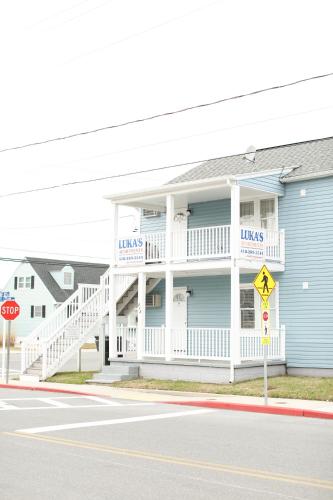 a blue and white building with a white balcony at Lukas Apartments in Ocean City