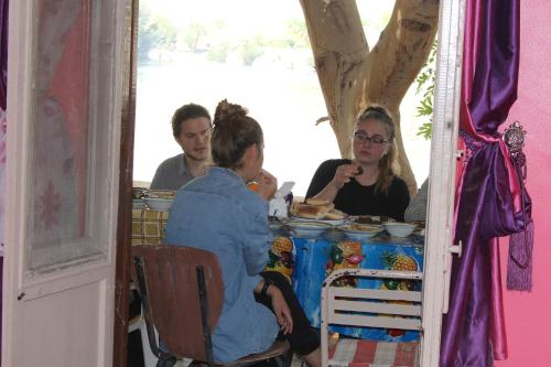 a group of people sitting at a table at Hamo Guest House in Aswan