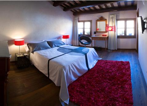 Cama ou camas em um quarto em L'ARGOLLA HOTEL-Pizzeria