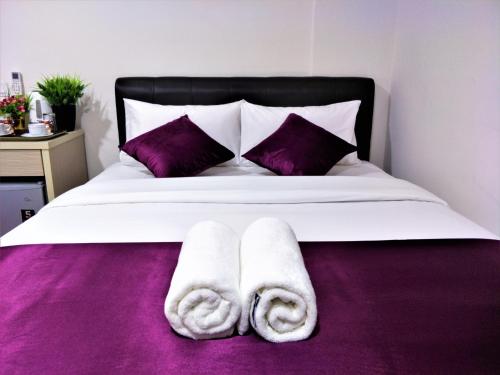 Postel nebo postele na pokoji v ubytování CITI HOTEL @ KL SENTRAL