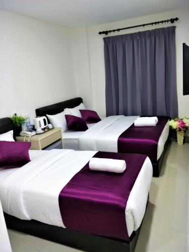 Postel nebo postele na pokoji v ubytování CITI HOTEL @ KL SENTRAL