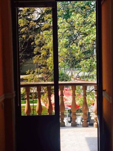 a window view of a balcony with vases at Hotel Kavkasioni in Kvareli
