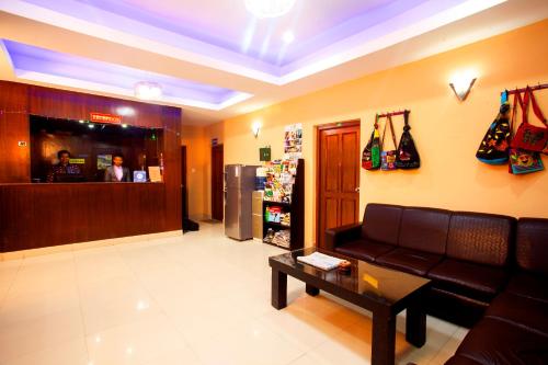 a living room with a couch and a coffee table at Hotel Dream City in Kathmandu