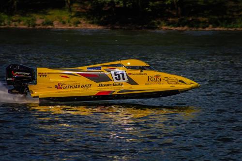 a yellow boat on a body of water at Pension "Haus am Walde" Brodenbach, Mosel in Brodenbach