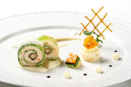 a plate of food on a white plate at Hotel Restaurant Krone in Hayna