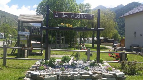 a sign for a park with a playground at Les Hauts Des Auches in Ancelle