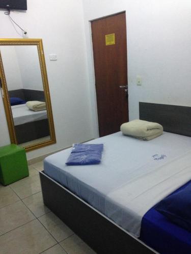 Katil atau katil-katil dalam bilik di Hotel Florêncio