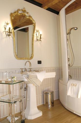 a bathroom with a sink and a mirror at Hotel Locanda Dei Mai Intees in Azzate