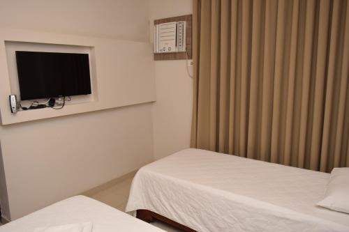 Katil atau katil-katil dalam bilik di Hotel Gramado de Campos