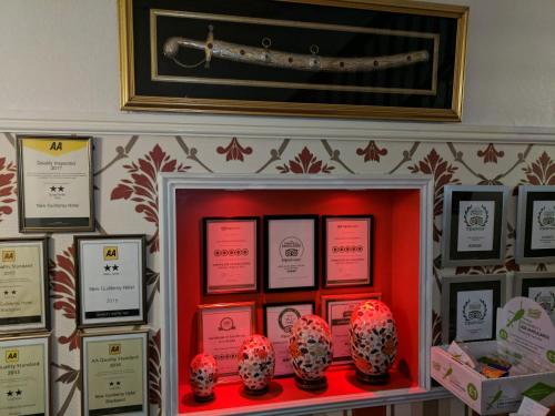 a display case in a room with hats on display at The New Guilderoy Hotel in Blackpool