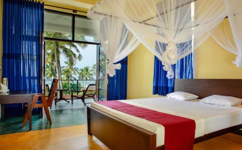 מיטה או מיטות בחדר ב-Sath Villa Naadi Ayurveda Resort