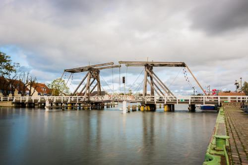 a large bridge over a river with water at Haus Vicus in Greifswald