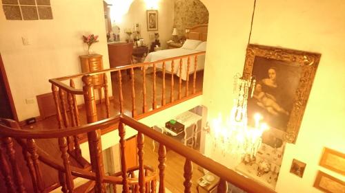 a staircase in a house with a picture on the wall at Mesón de Santa Teresa in Puebla