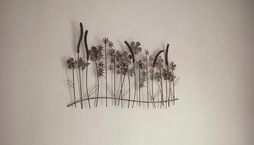 a bunch of flowers hanging on a wall at The Gatsby Blackpool - Formerly The Windsor in Blackpool