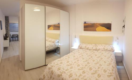 A bed or beds in a room at VV Canteras Sol y Playa
