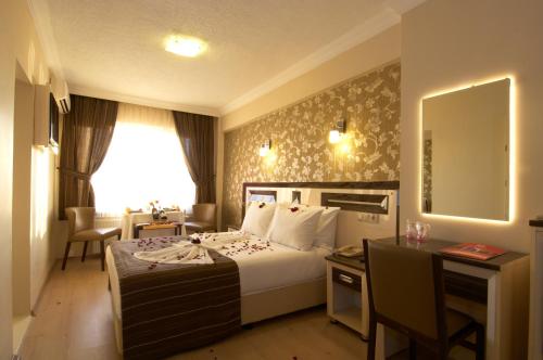 Postel nebo postele na pokoji v ubytování Soyic Hotel