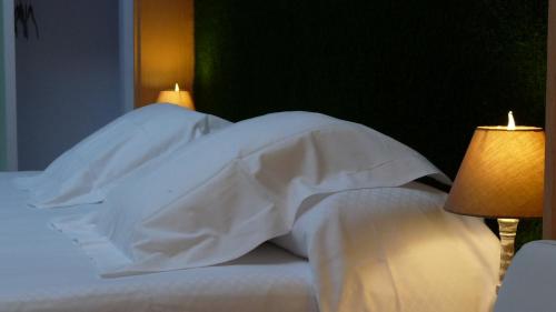 Postel nebo postele na pokoji v ubytování Hotel Ribes Roges